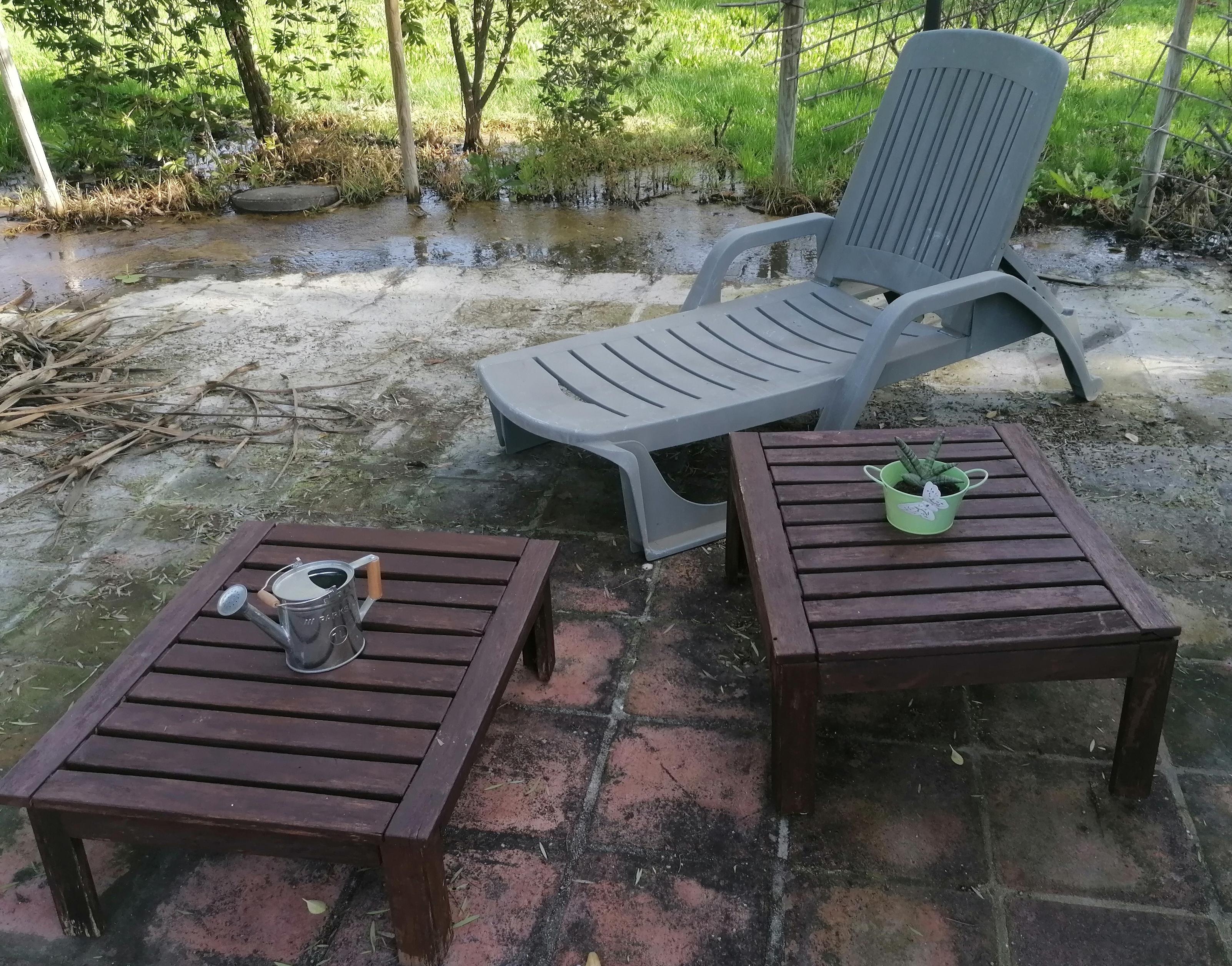 A puréed and simmering carrot soup in a pot with a spoon